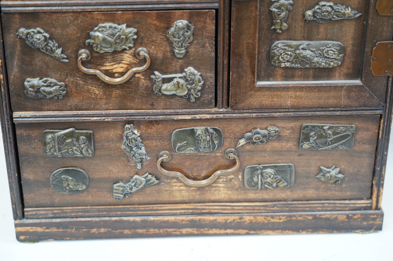 A late 19th century Japanese desk top dansu cabinet, 33.5x 29cm. Condition - fair